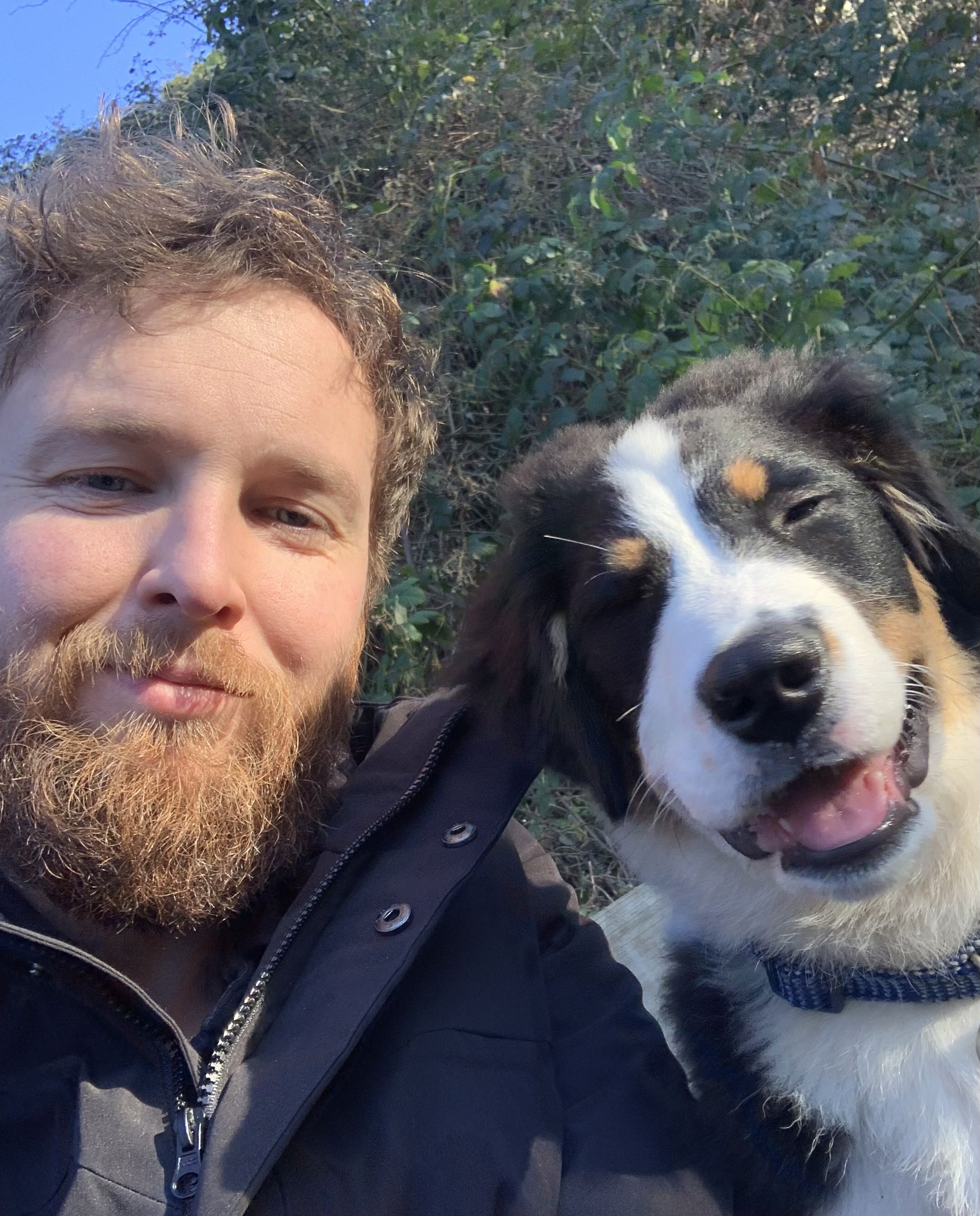 Ryan outdoors with his dog